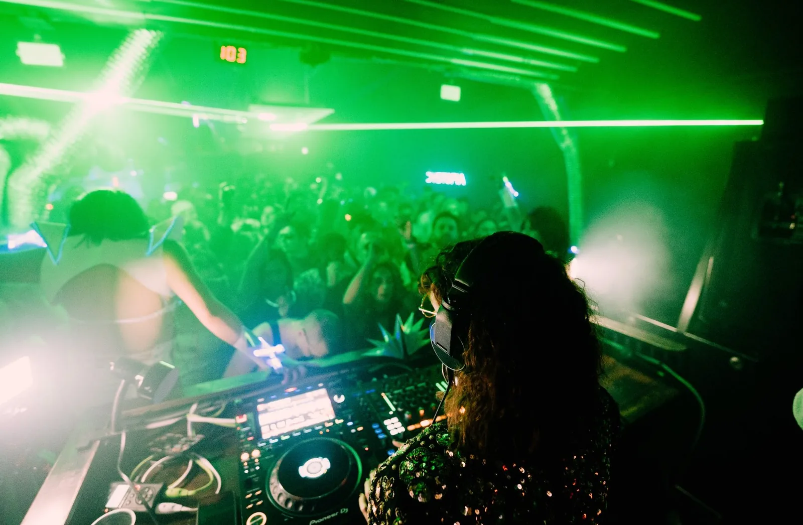 Valeria of RSN8 performing under green lasers, Toronto